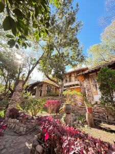 A photo of the Willkamayu Spirit ceremony centre - view is from outside with a beautiful terraced stone garden and vegetation.